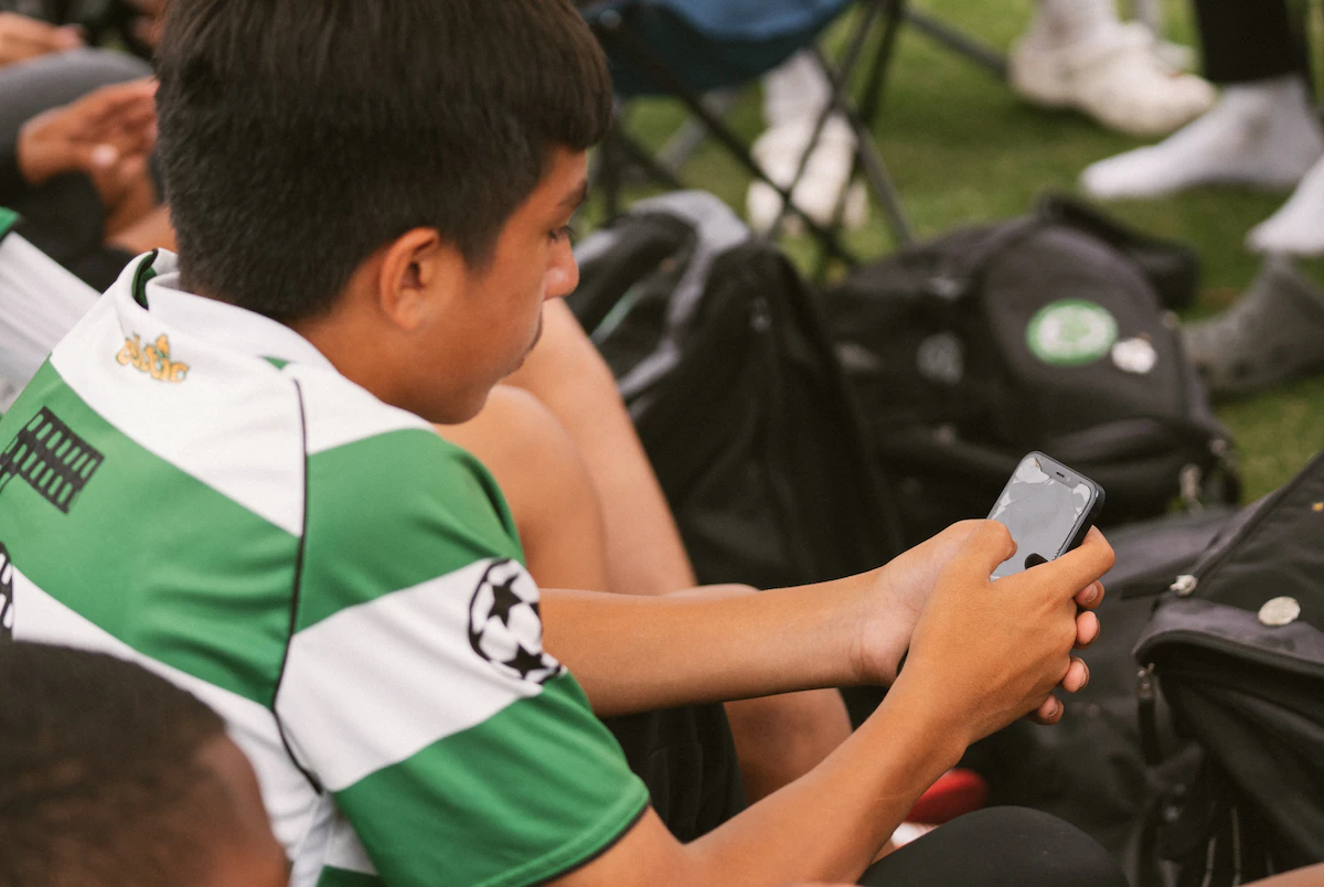 Soccer player on phone